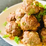 Plate of beef meatballs with parsley garnish