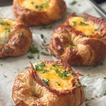 Tray of croissants filled with eggs and bacon