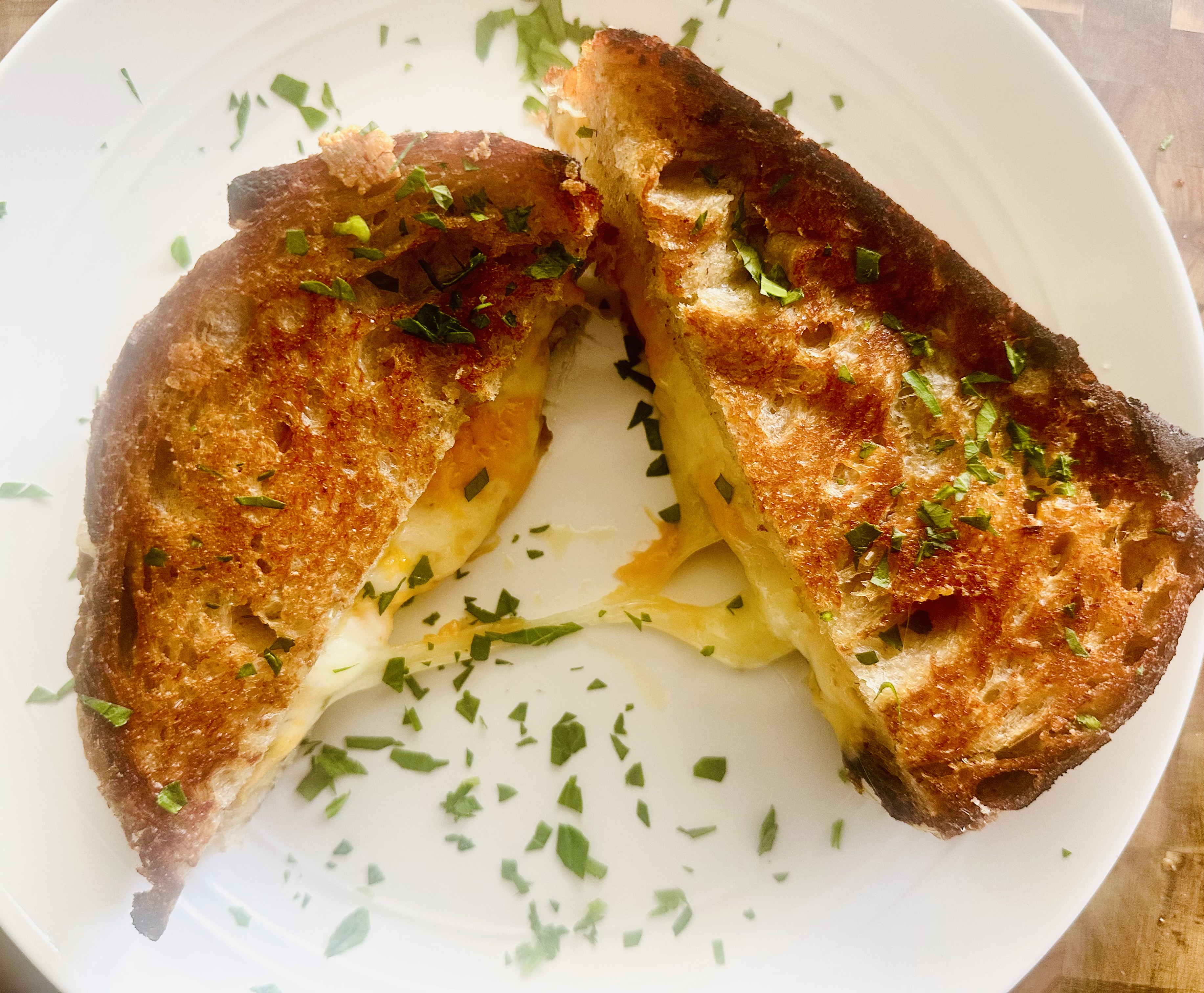 Plate with a sliced grilled cheese sandwich