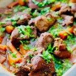 Roasted lamb and root veggies in a baking dish