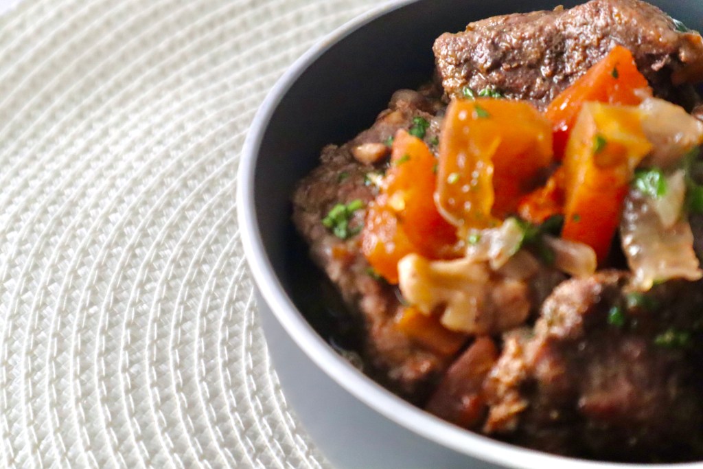 Roasted lamb and root vegetables in a bowl