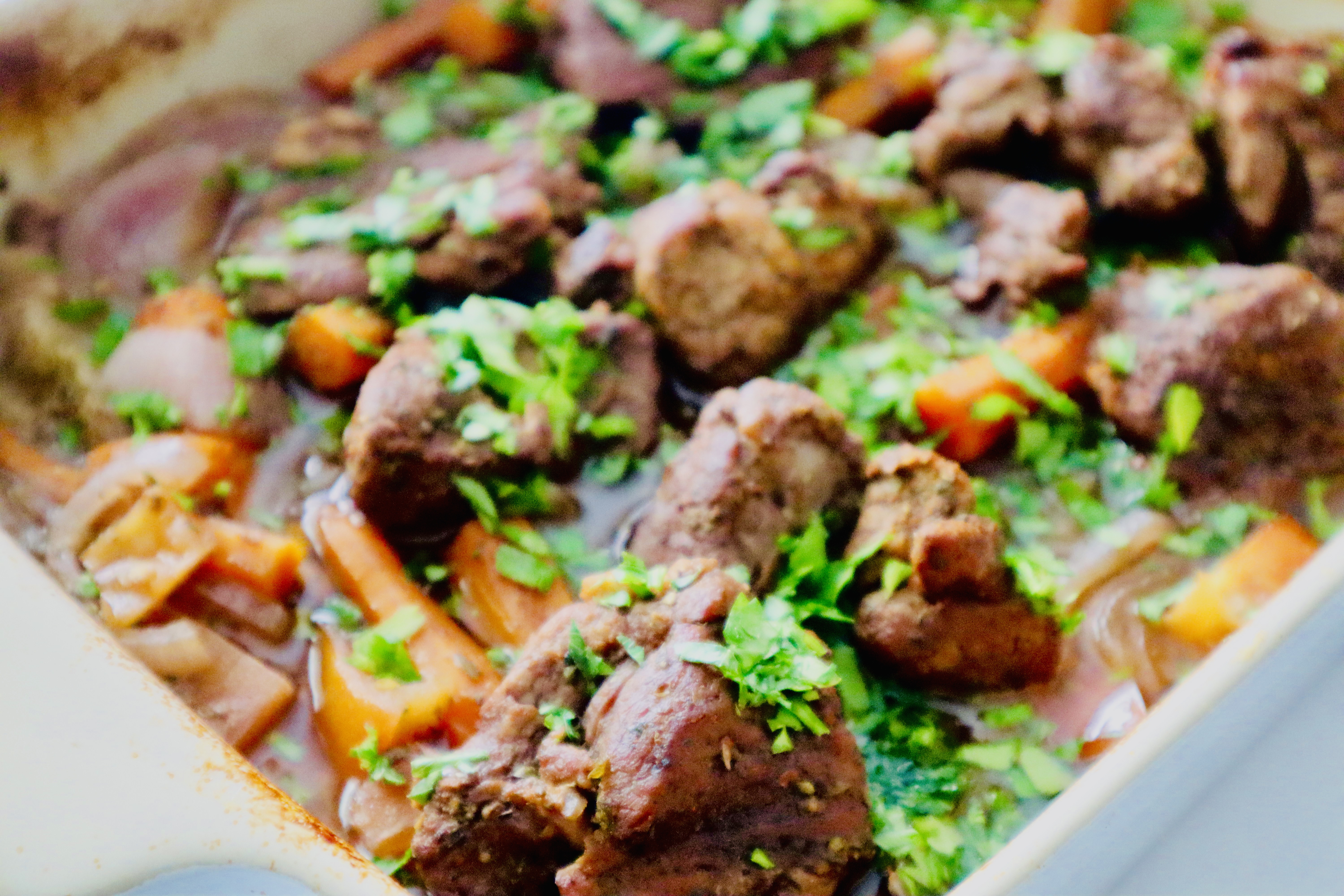 Roasted lamb and root veggies in a baking dish
