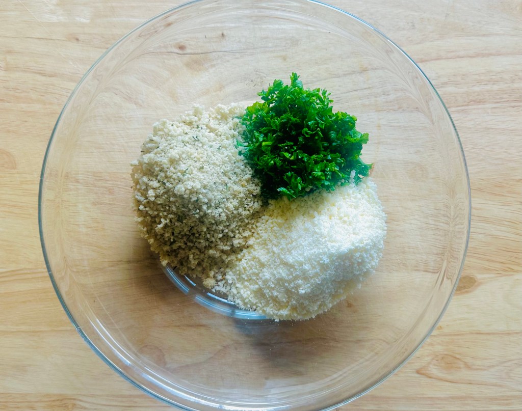 Glass bowl of panko, Parmesan, and parsley