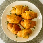 Plate of baked Philly cheesesteak crescent rolls