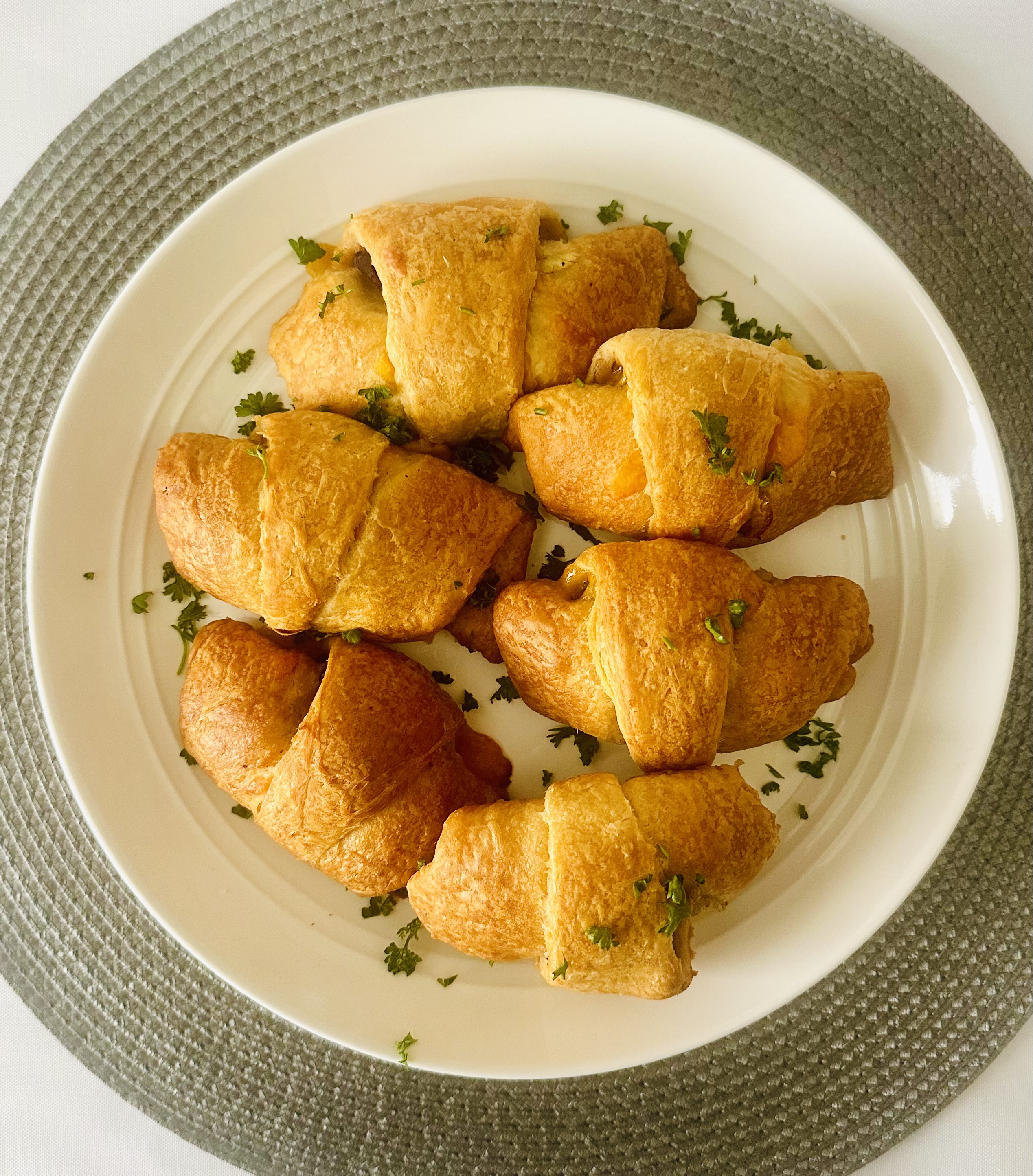Plate of baked Philly cheesesteak crescent rolls