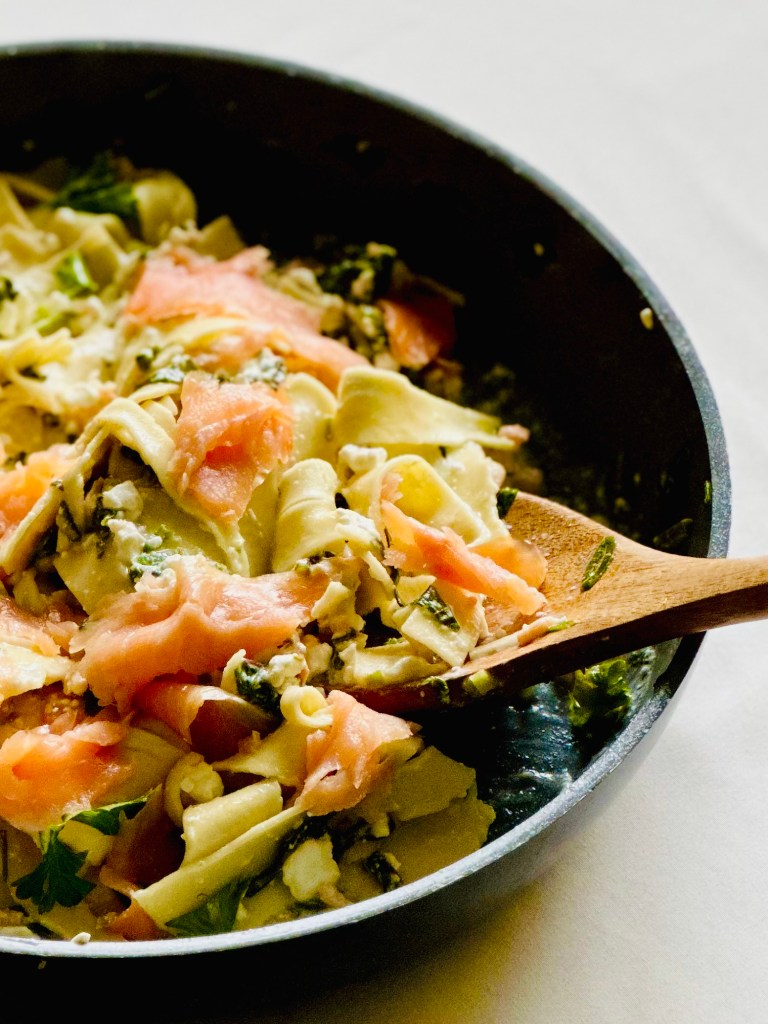 Smoked salmon layered with lasagna, cottage cheese, Parmesan cheese, lemon, and greens
