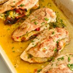 Baked chicken breasts stuffed with spinach, cheese, and sun-dried tomatoes