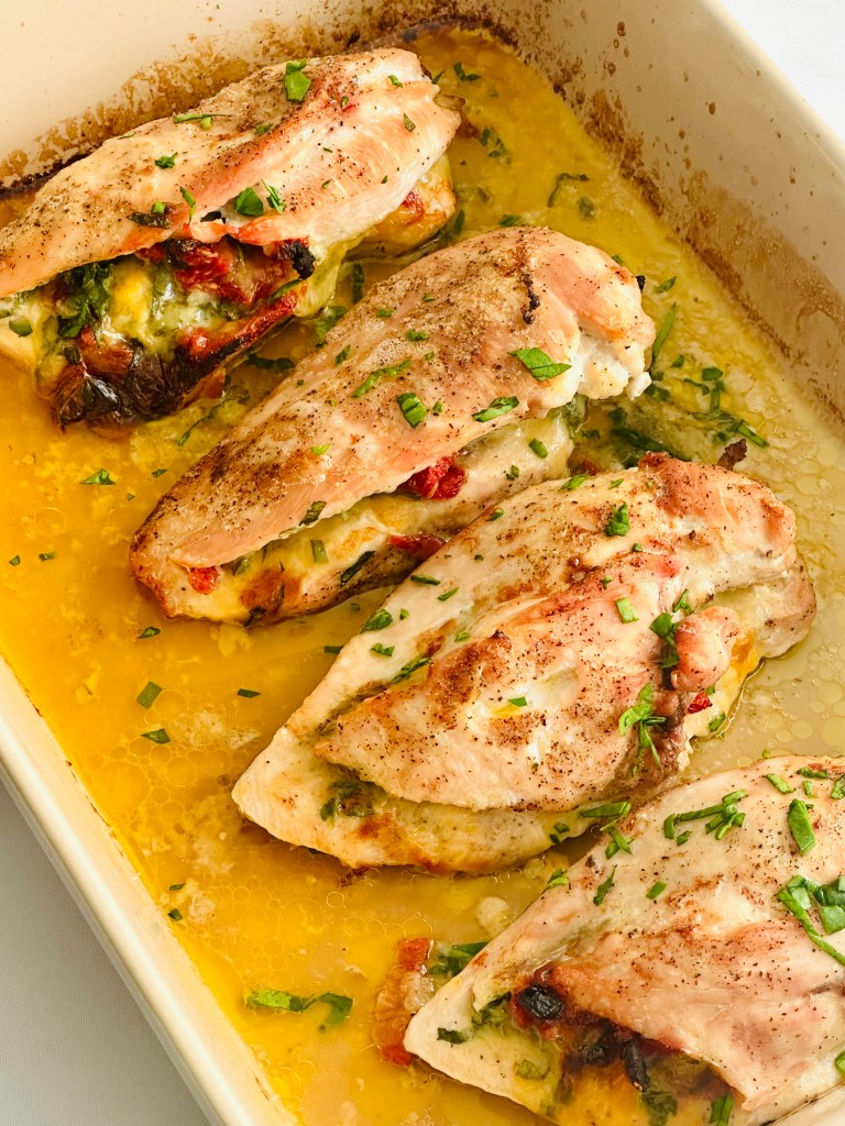 Baked chicken breasts stuffed with spinach, cheese, and sun-dried tomatoes