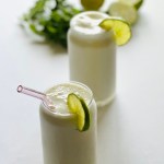 Tall glasses filled with Brazilian lemonade and served with lime wheels