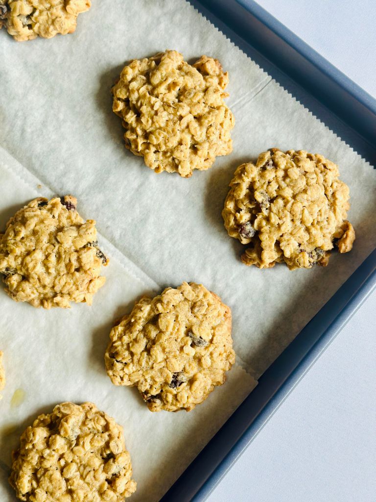 Tray of baked oatmeal raisin cookies