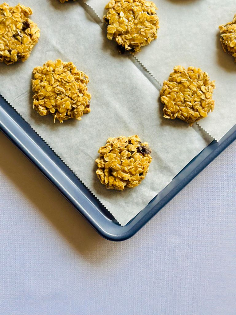 Tray of unbaked oatmeal raisin cookies