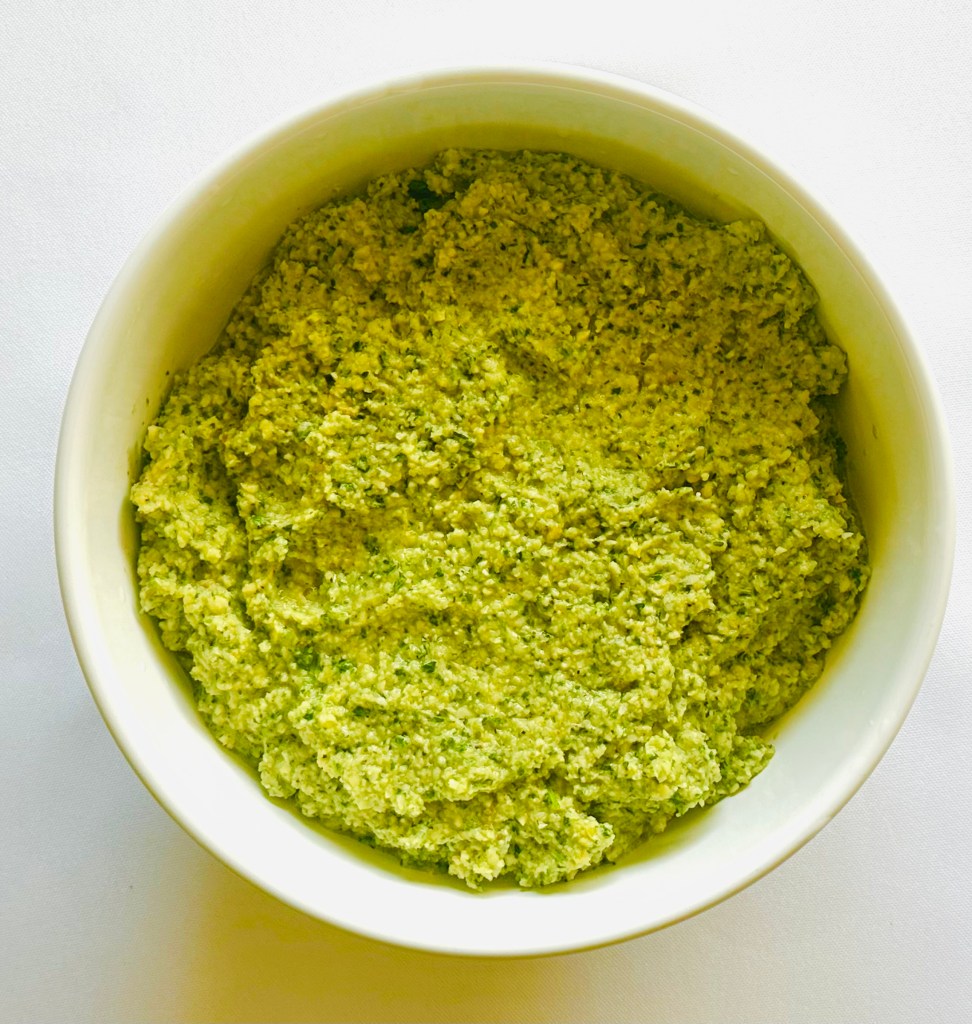 A bowl of tahini mixture that was pureed in a food processor