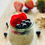 Jar filled with overnight oats and assorted berries