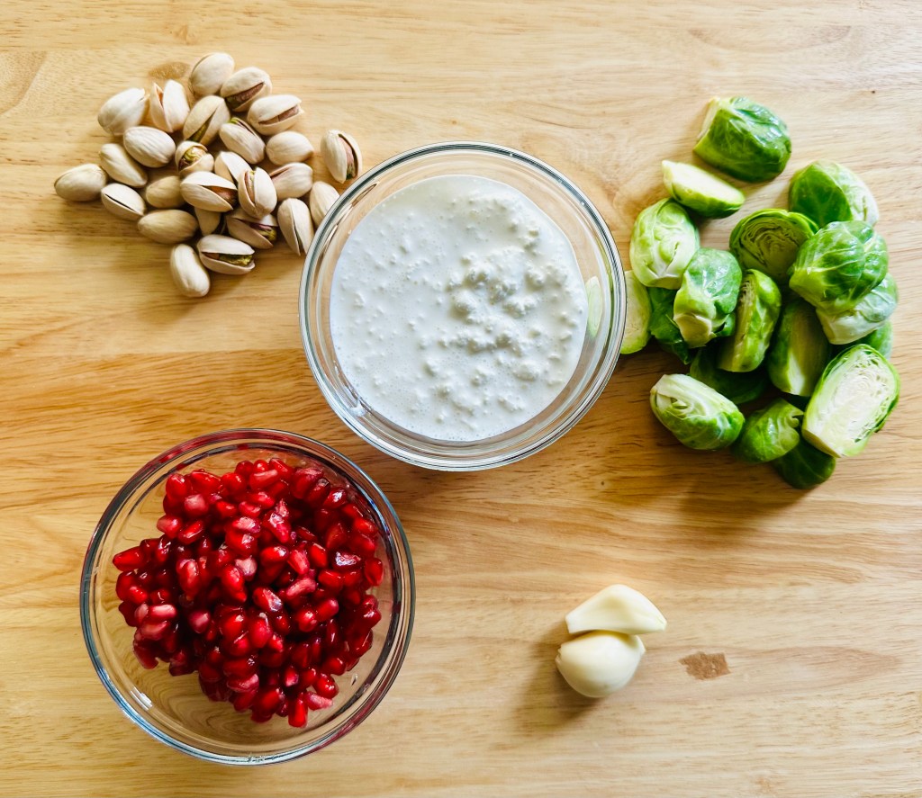 Photo of ingredients used to make crispy Brussels sprouts with pomegranate and pistachio