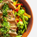Serving bowl of pan-fried flat iron steak with vegetables