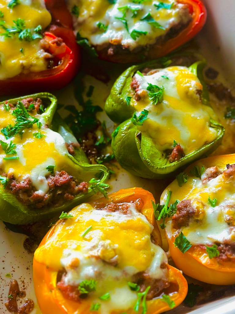 Stuffed bell peppers filled with ground beef, veggies, and melted cheese