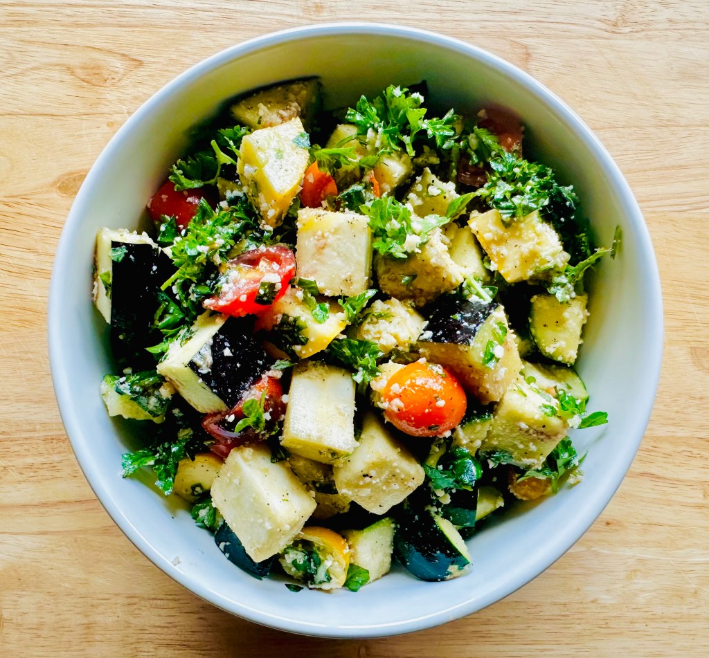 Ingredients used to make a baked eggplant, zucchini, and tomato casserole