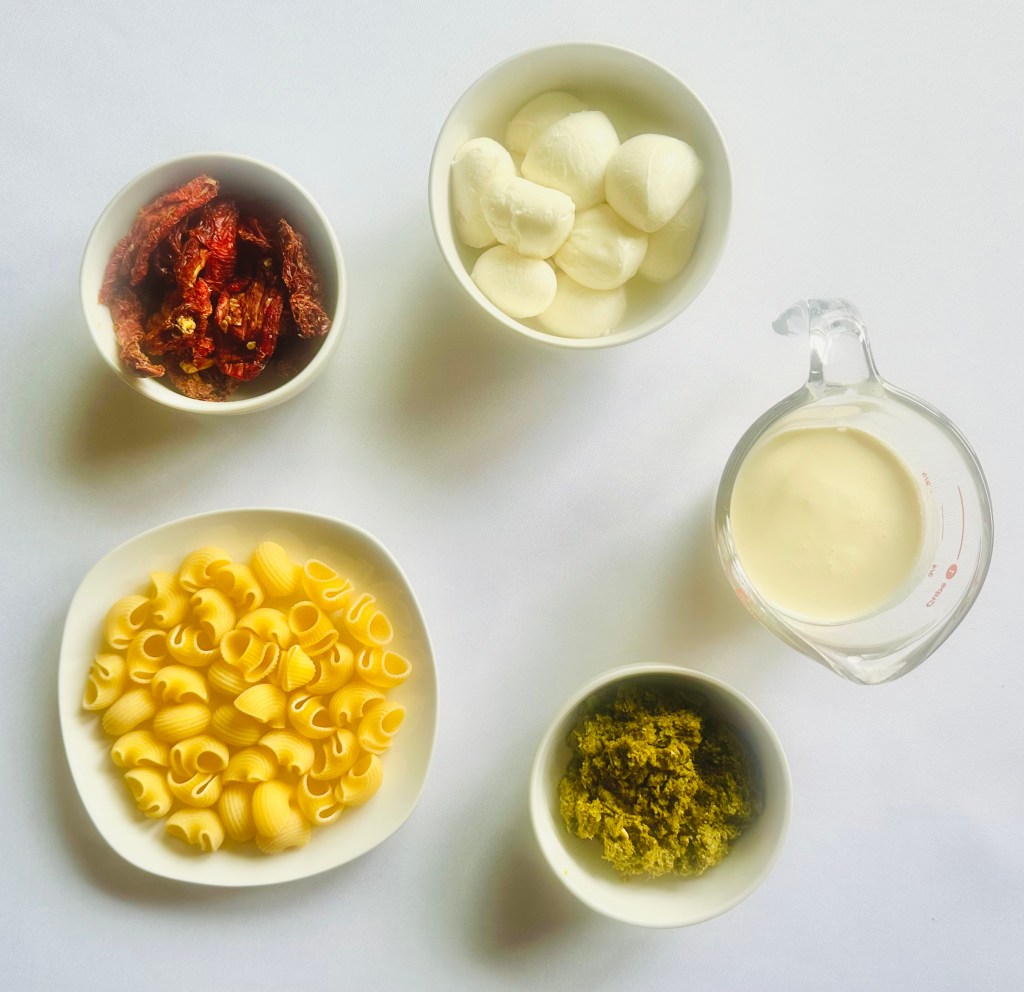 A photo of the ingredients used to make creamy pesto pasta