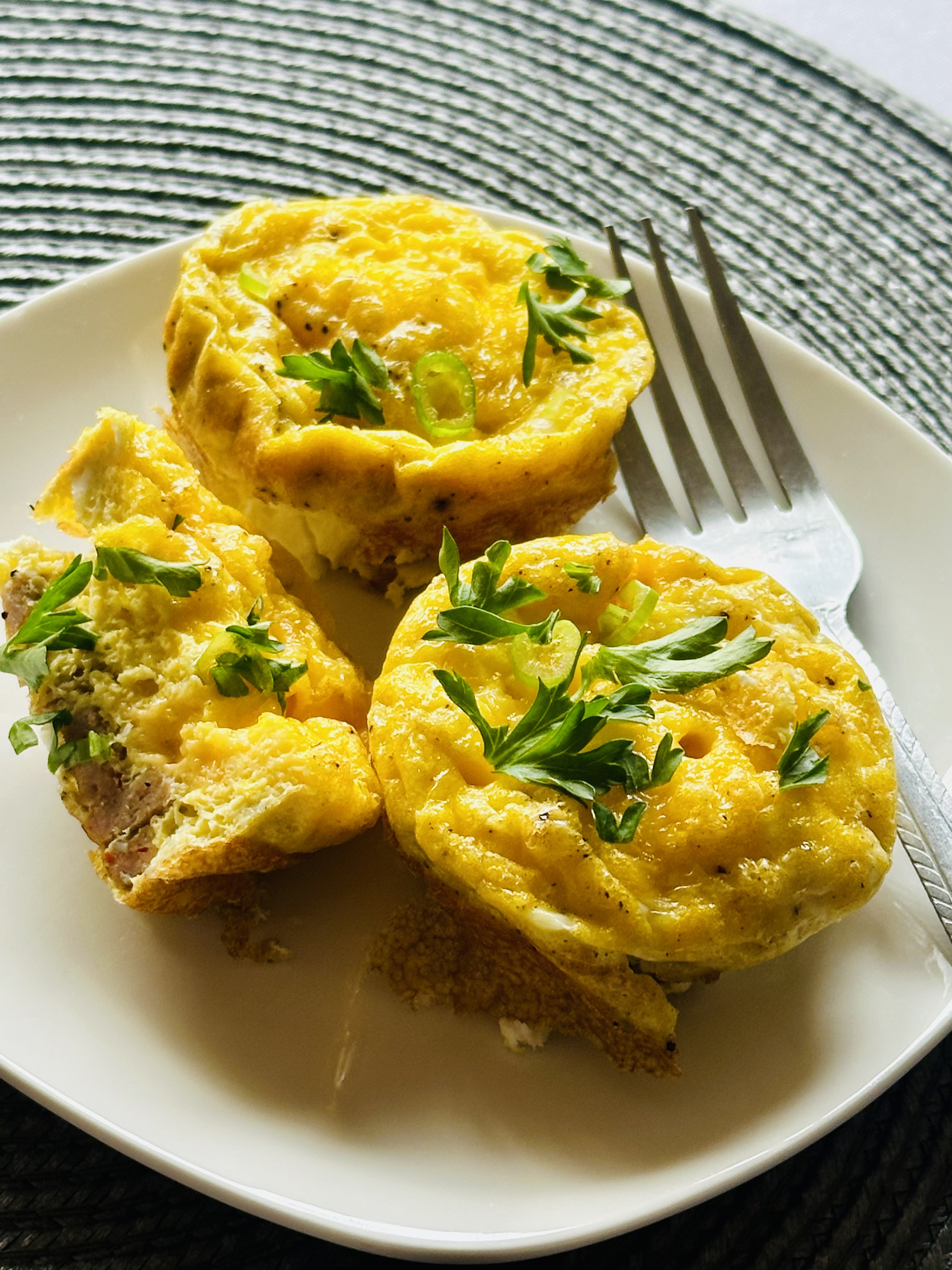 A plate full of homemade breakfast sausage egg muffins
