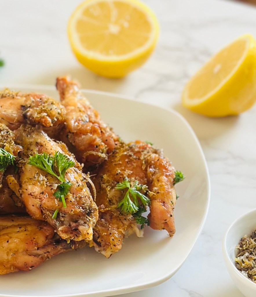 A plate full of crispy lemon pepper chicken wings