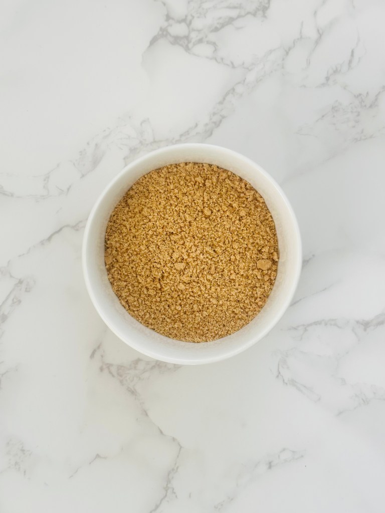 A bowl of graham cracker crumbs