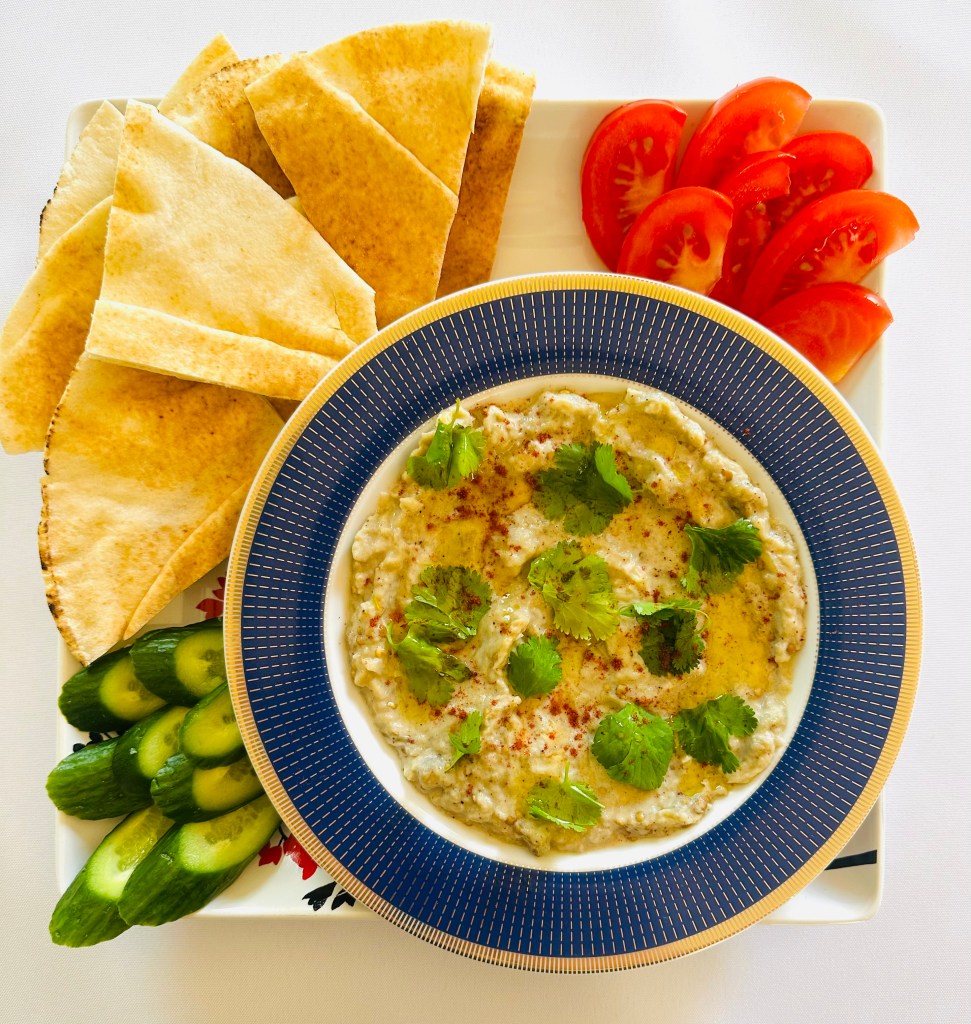 Homemade baba ganoush served with pita bread and veggies