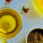 A freshly prepared teapot and cup of warm fenugreek tea