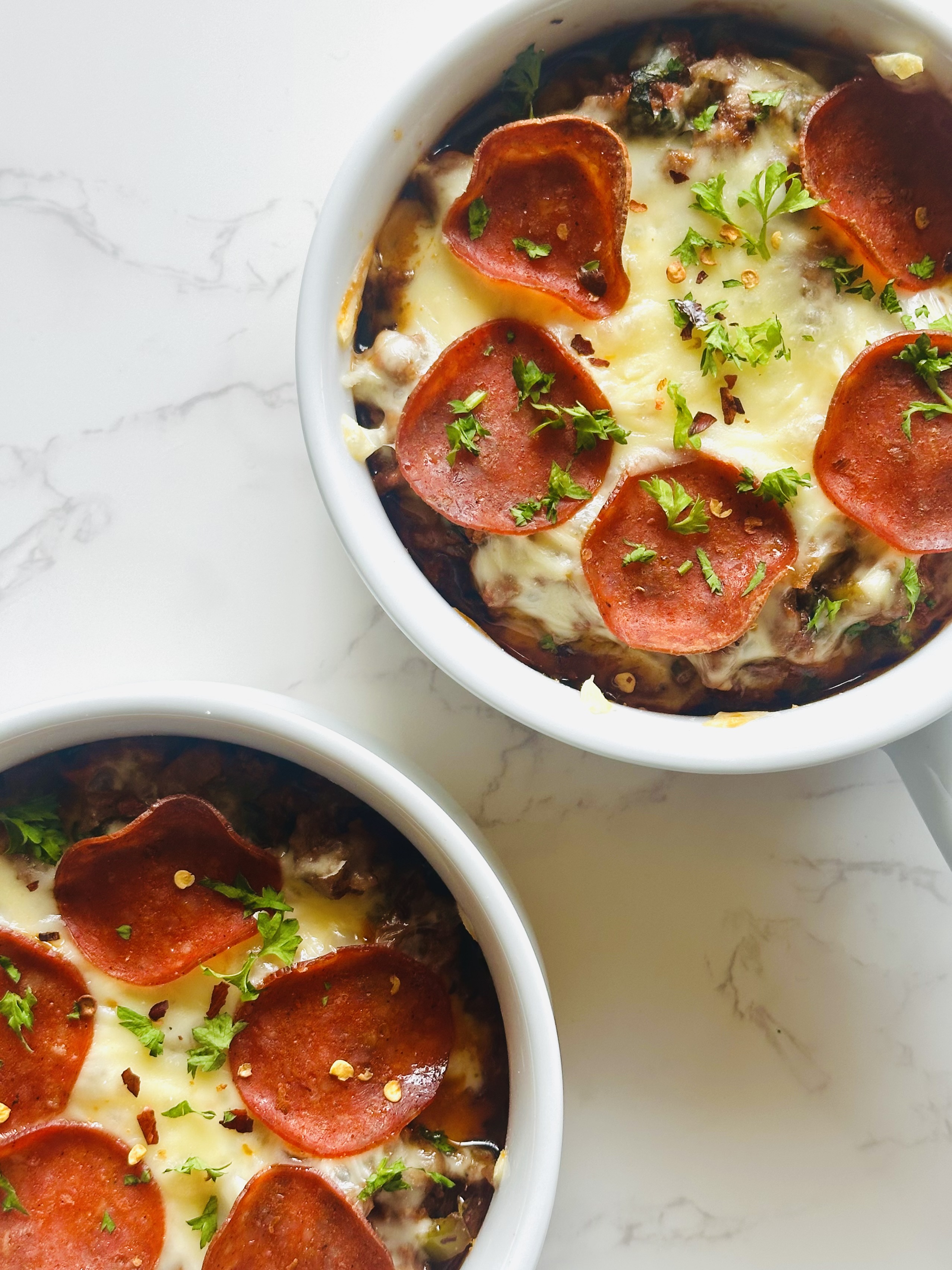 Crustless pizza bowls with topping of mozzarella and turkey pepperoni